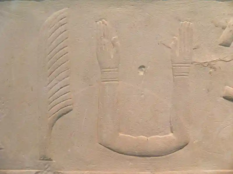 Feather, and the ka (connected hands) symbol